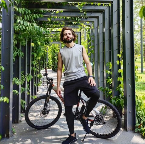 the founder of the future you lab riding a bicycle at the park 